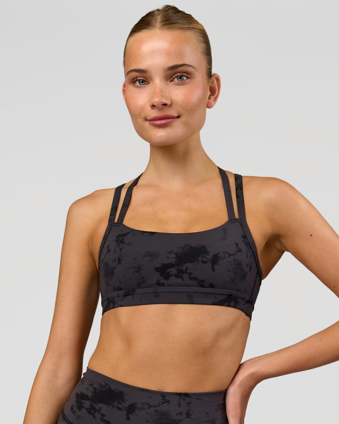 Woman wearing Velocity Sports Bra - Black Tie Dye | Model:Taneisha | Size:XS - view 4