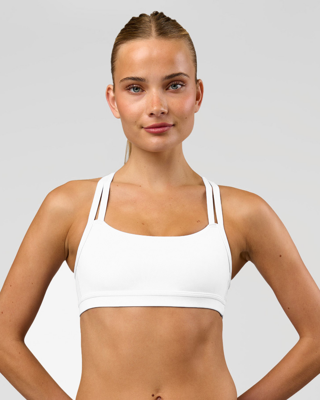 Woman wearing Velocity Sports Bra - White | Model:Taneisha | Size:XS - view 5