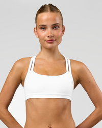 Woman wearing Velocity Sports Bra - White | Model:Taneisha | Size:XS | Thumbnail Index: 4