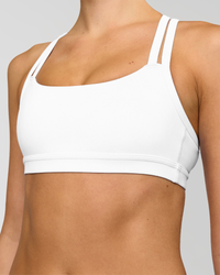 Woman wearing Velocity Sports Bra - White | Model:Taneisha | Size:XS | Thumbnail Index: 1