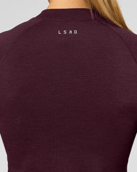 Woman wearing AeroFLX+ Long Sleeve Half Zip - Cherry Lacquer/Cherry Laquer | Model:Taniesha | Size:XS | Thumbnail Index: 14
