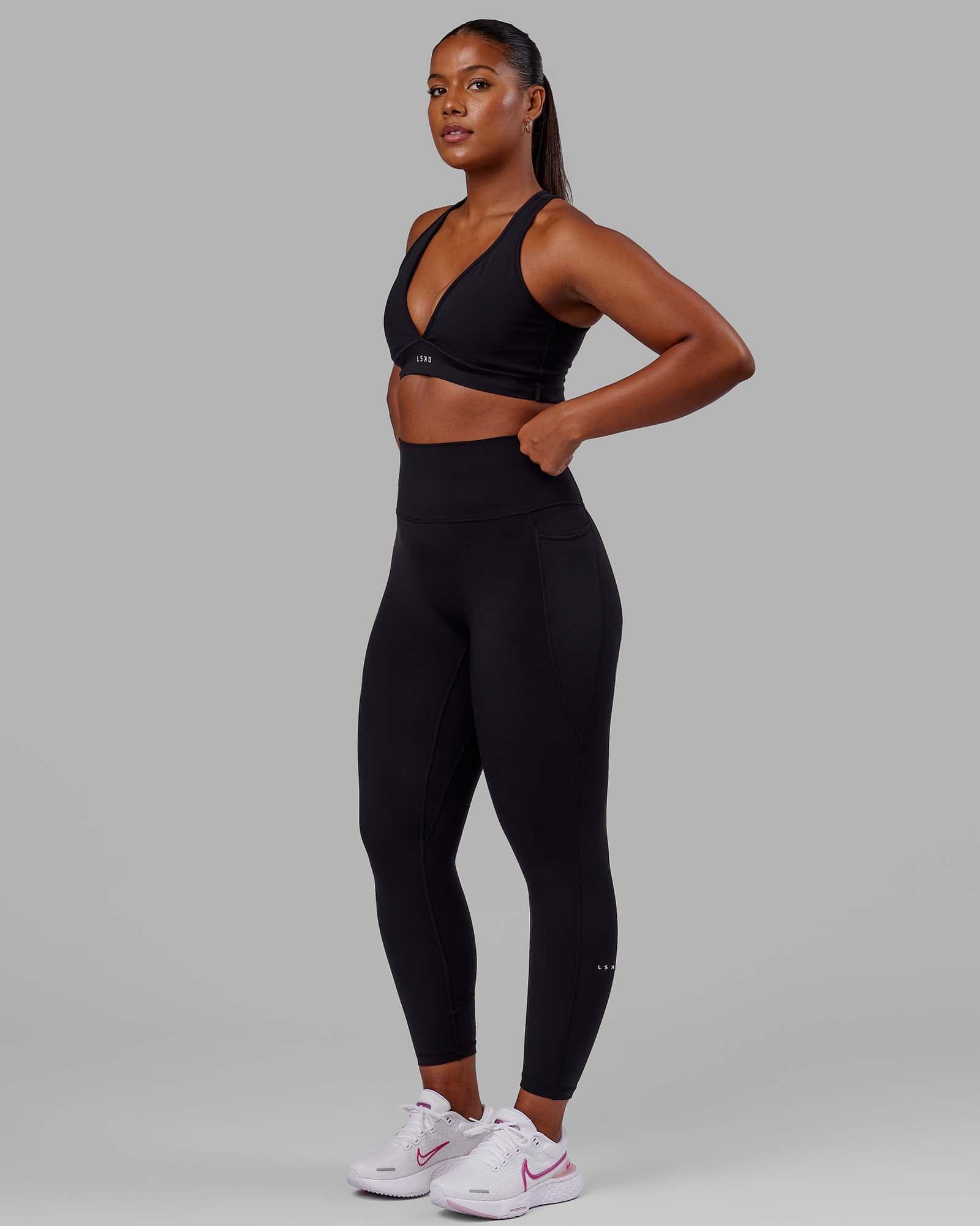 Woman wearing O.G. Fusion Ultra High-Rise Full Length Legging Pockets - Black | Model:Krystal | Size:L