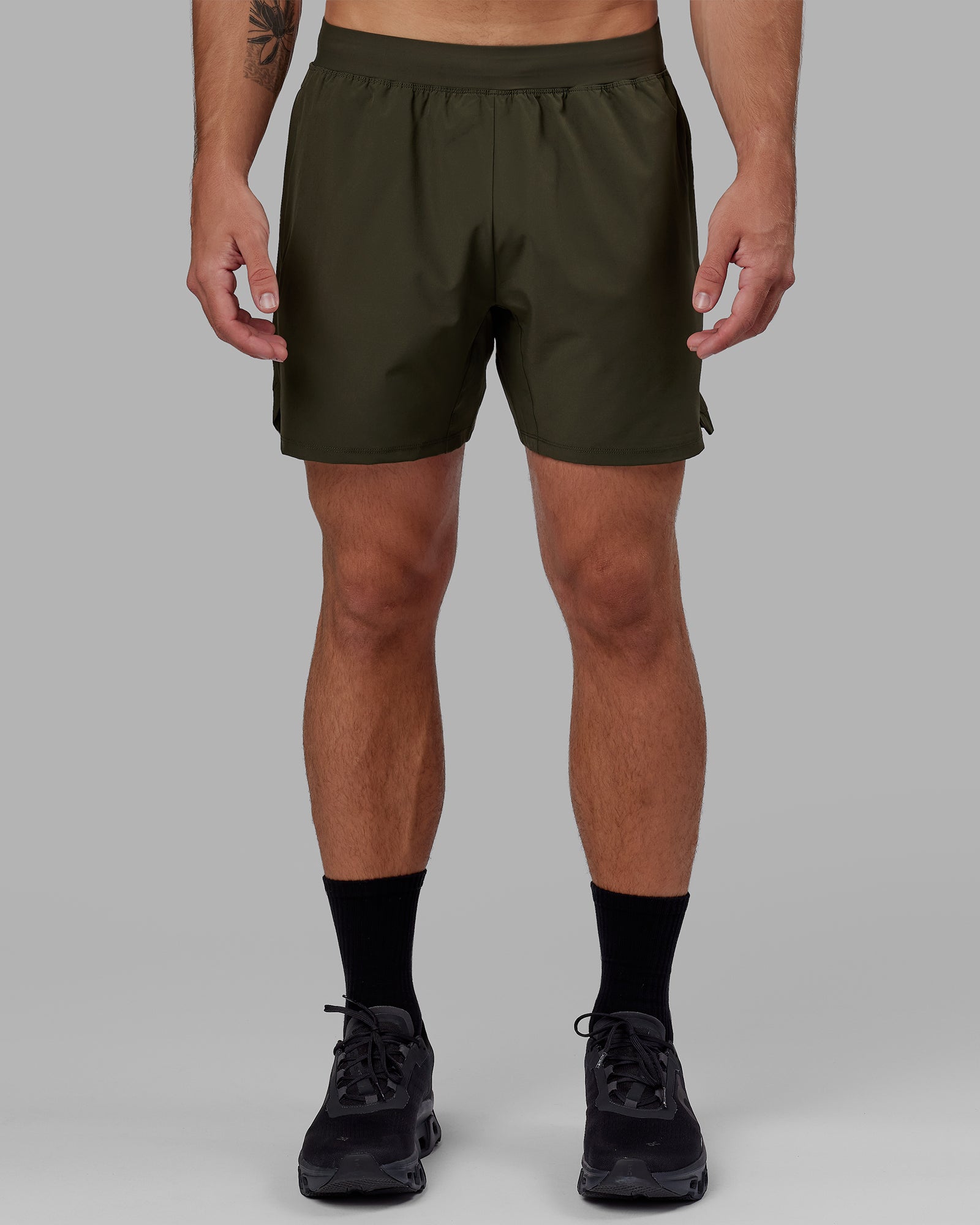 Man wearing Challenger 6" Lined Performance Short - Forest Night
