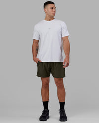 Man wearing Challenger 6" Lined Performance Short - Forest Night