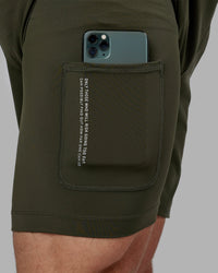 Man wearing Challenger 6" Lined Performance Short - Forest Night