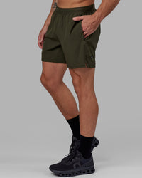 Man wearing Challenger 6" Performance Short - Forest Night