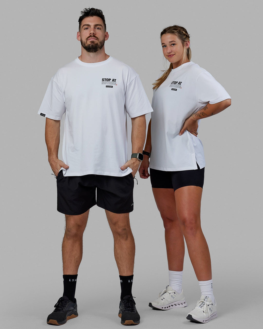 Man and Women Wearing Unisex Fitstop Stop at Nothing Tee Oversize - White-Black