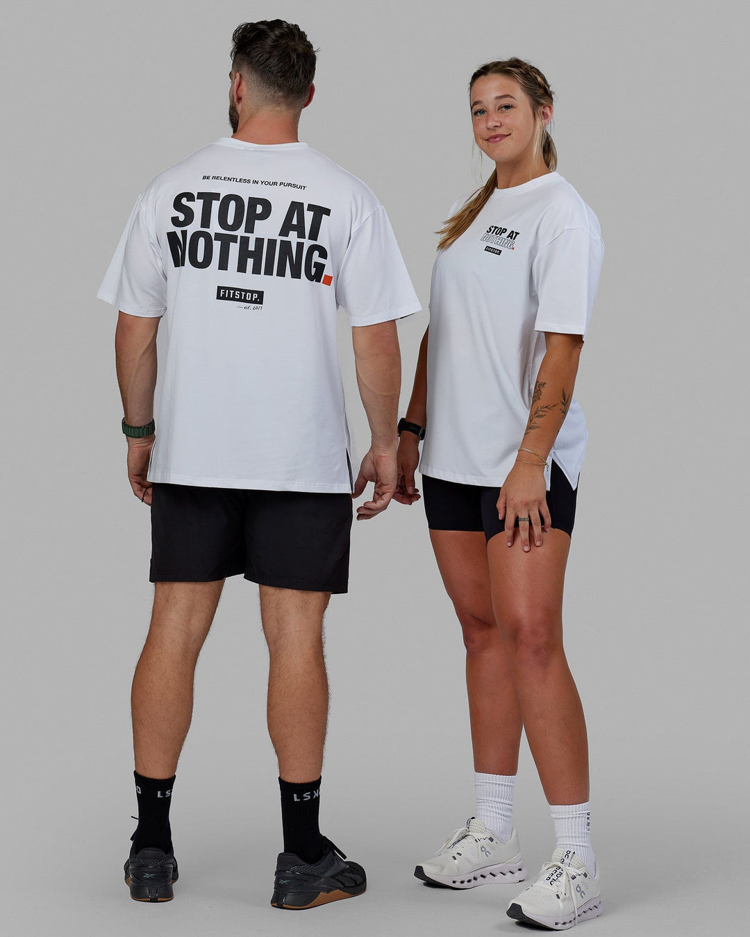 Man and Women Wearing Unisex Fitstop Stop at Nothing Tee Oversize - White-Black