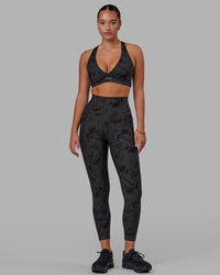 Woman wearing Fusion Ultra High-Rise 7/8 Legging Pockets - Black Tie-Dye | Model:Milly | Size:S