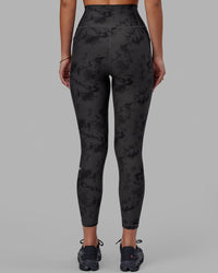 Woman wearing Fusion Ultra High-Rise 7/8 Legging Pockets - Black Tie-Dye | Model:Milly | Size:S