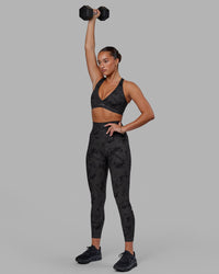 Woman wearing Fusion Ultra High-Rise 7/8 Legging Pockets - Black Tie-Dye | Model:Milly | Size:S