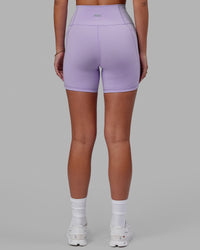Woman wearing Fusion Ultra High-Rise 6" Short Pockets - Pale Lilac | Model:Milly | Size:S