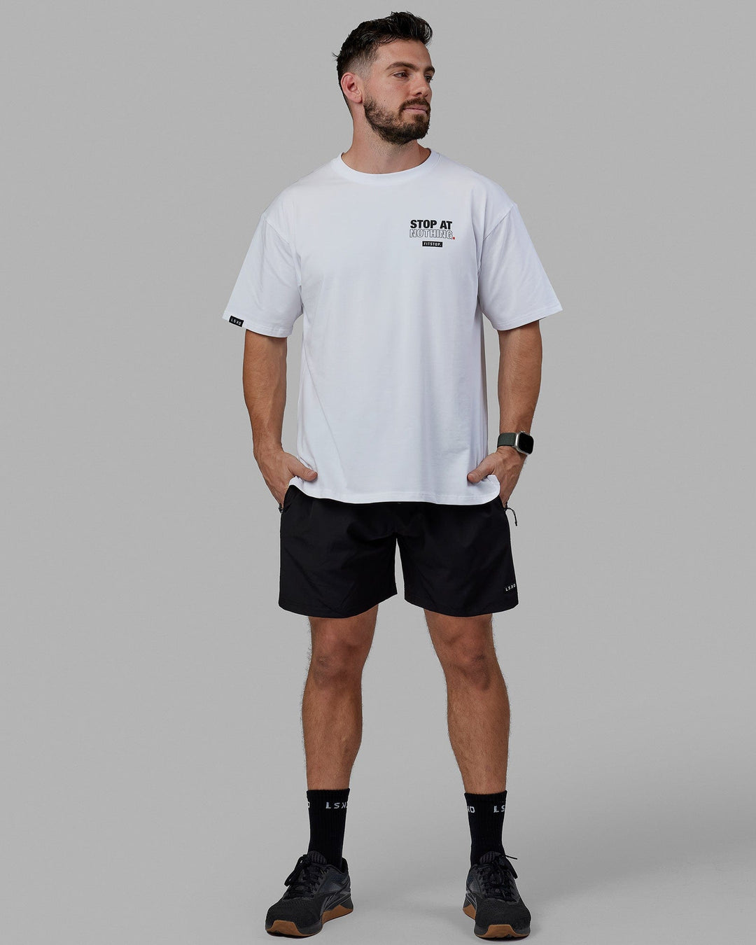 Man Wearing Unisex Fitstop Stop at Nothing Tee Oversize - White-Black