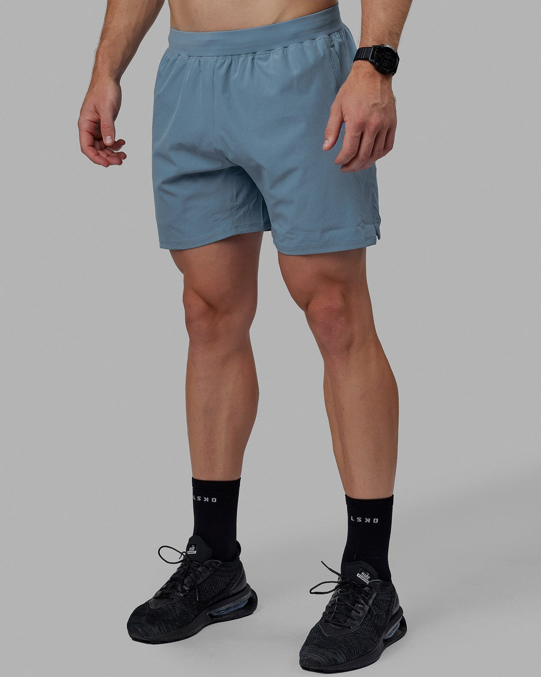 Man wearing Challenger 6&quot; Lined Performance Shorts - Elemental Blue