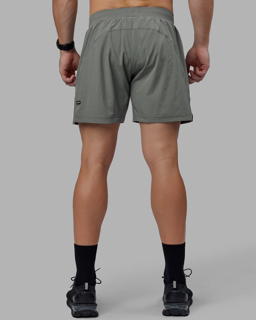 Man wearing Challenger 6&quot; Lined Performance Short - Graphite