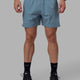 Man wearing Challenger 6" Performance Shorts - Elemental Blue