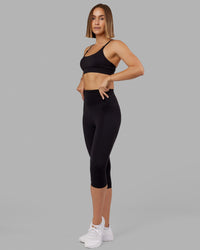 Woman wearing Elixir Ultra High-Rise 3/4 Legging - Black | Model:Chelsea | Size:S