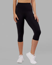 Woman wearing Elixir Ultra High-Rise 3/4 Legging - Black | Model:Chelsea | Size:S