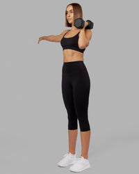 Woman wearing Elixir Ultra High-Rise 3/4 Legging - Black | Model:Chelsea | Size:S