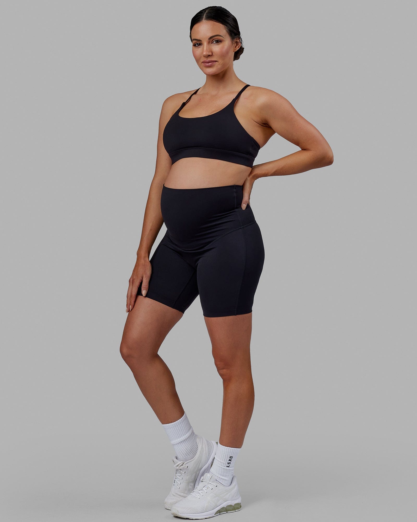 Woman wearing Elixir Ultra High-Rise Maternity 6" Short - Black | Model:Amanda | Size:S