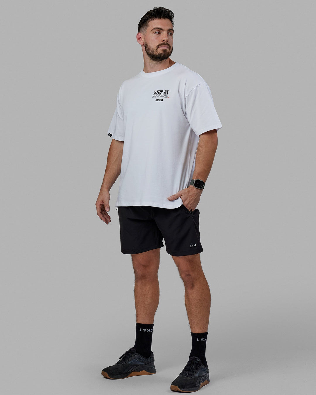 Man Wearing Unisex Fitstop Stop at Nothing Tee Oversize - White-Black