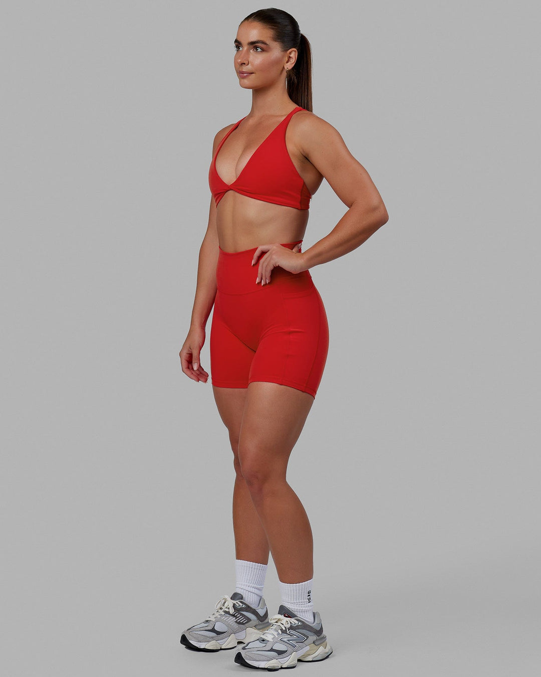 Woman wearing Fusion Ultra High-Rise 6" Short Pockets - Infrared | Model:Annabelle | Size:S