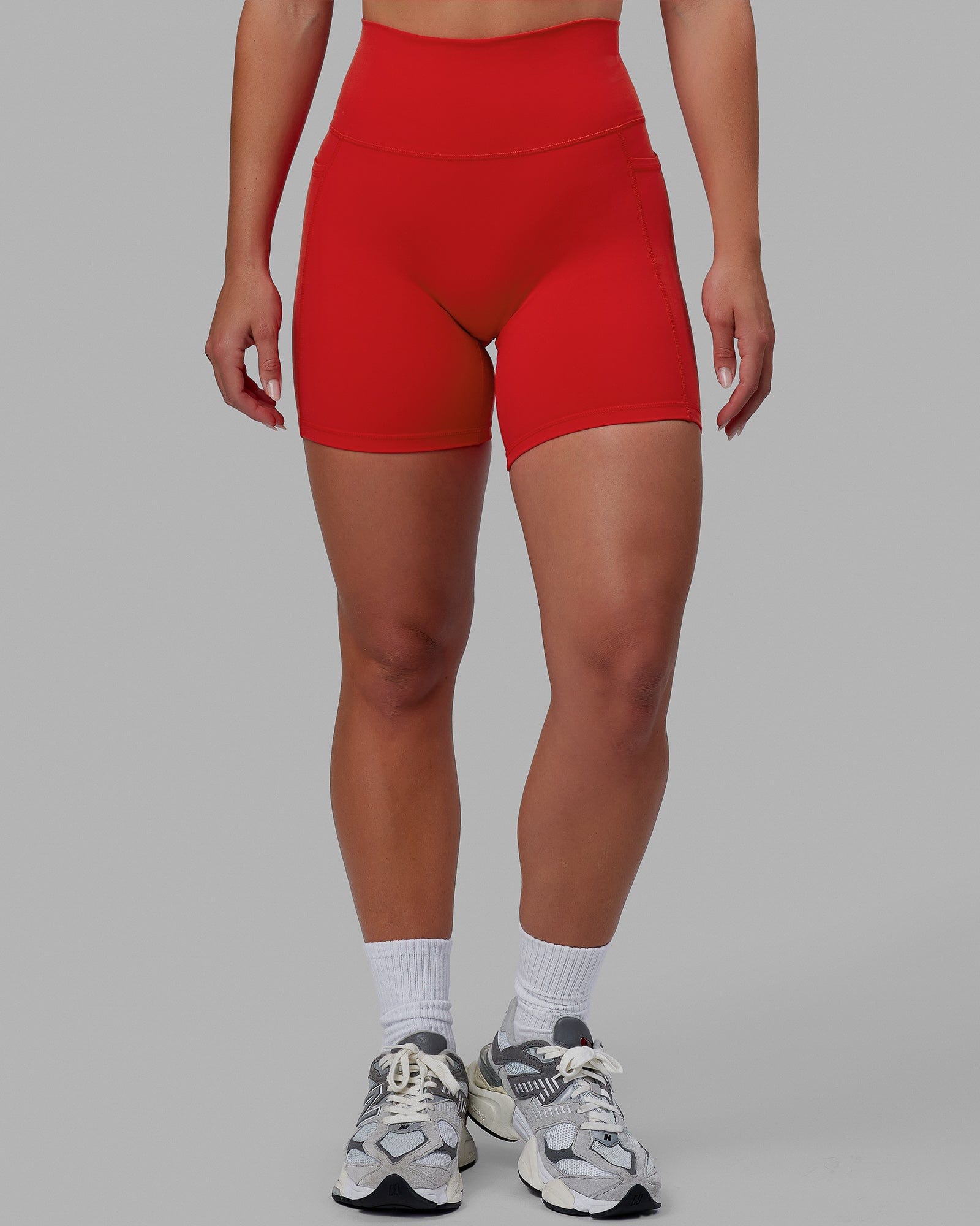 Woman wearing Fusion Ultra High-Rise 6" Short Pockets - Infrared | Model:Annabelle | Size:S