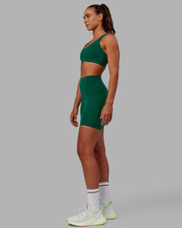 Woman wearing Fusion Ultra High-Rise 6" Short Pockets - Malachite | Model:Sophie | Size:S