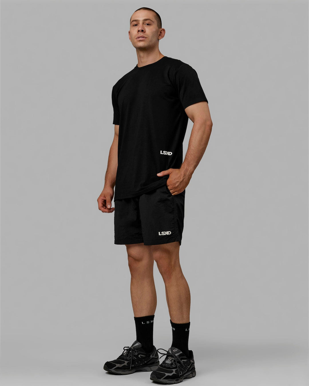 Man wearing Millennium 7" Shorts - Black