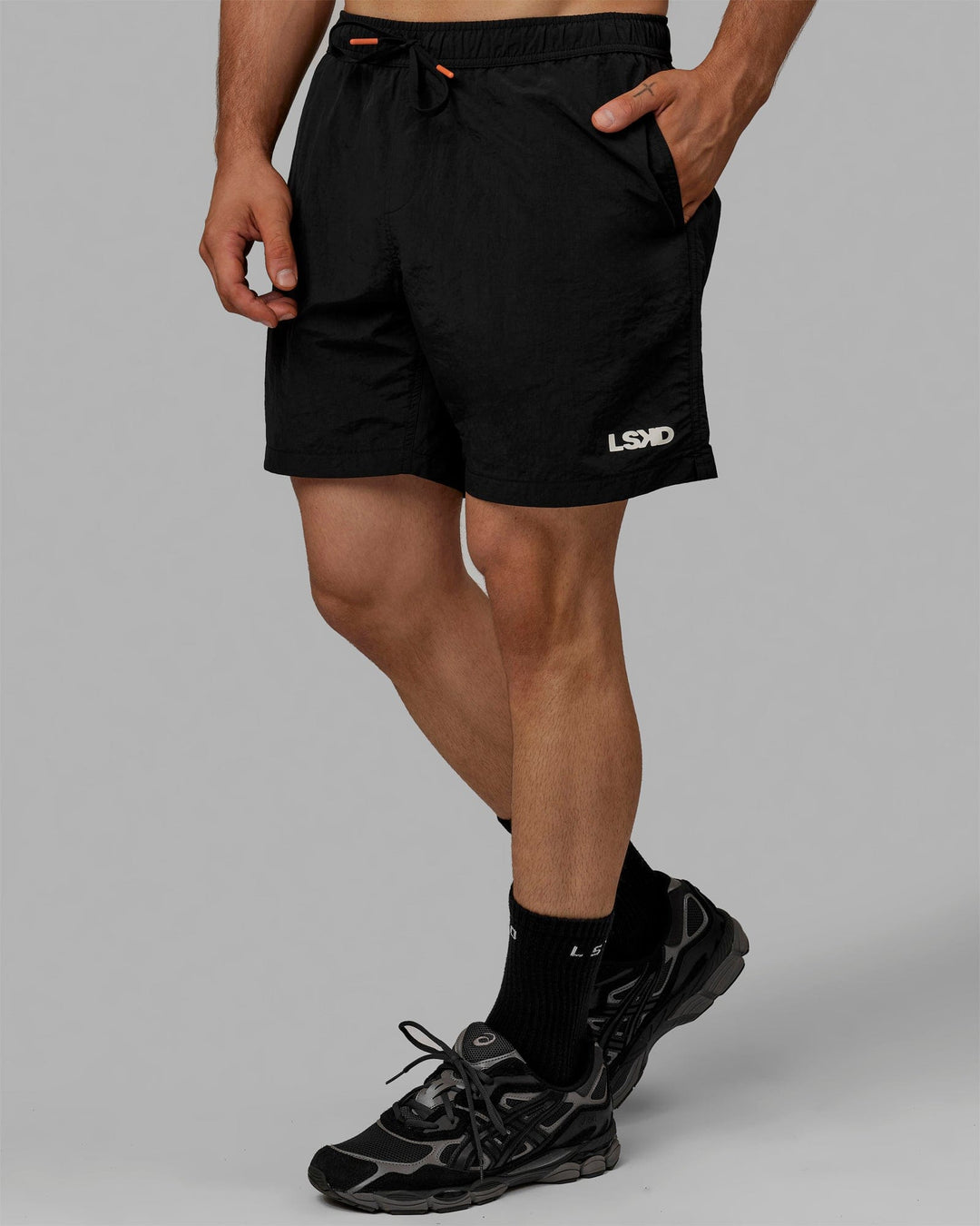 Man wearing Millennium 7" Shorts - Black
