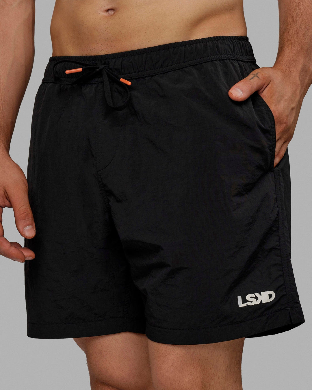 Man wearing Millennium 7" Shorts - Black