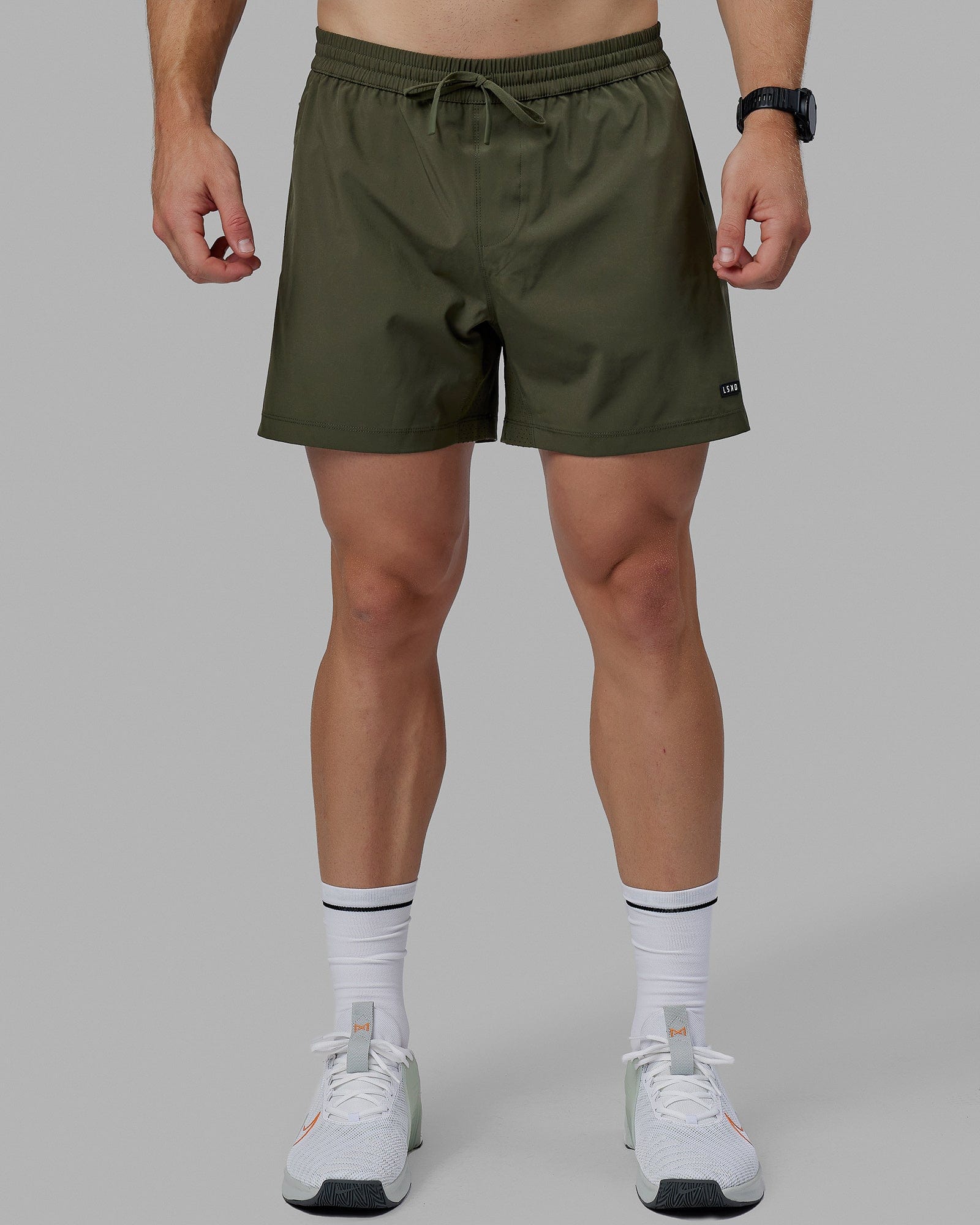 Man wearing Rep 5" Lined Performance Short - Forest Night