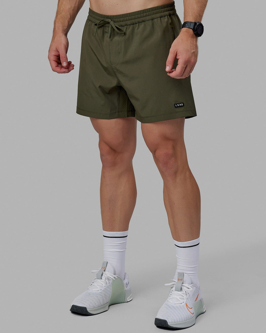 Man wearing Rep 5&quot; Lined Performance Short - Forest Night