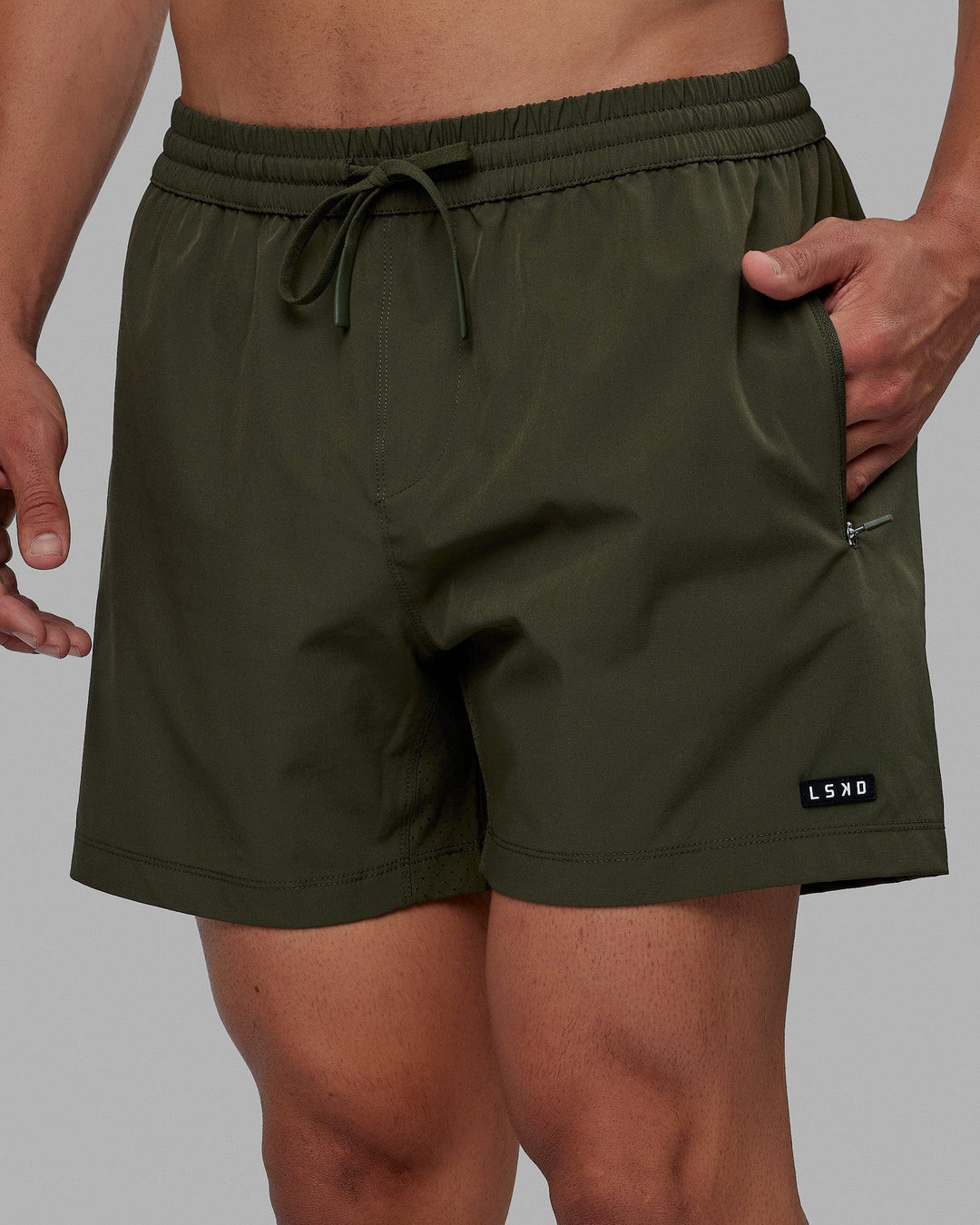 Man wearing Rep 5'' Performance Short - Forest Night