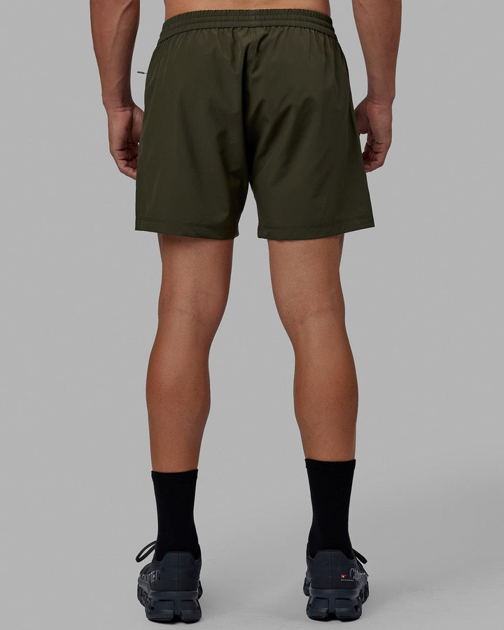 Man wearing Rep 5'' Performance Short - Forest Night
