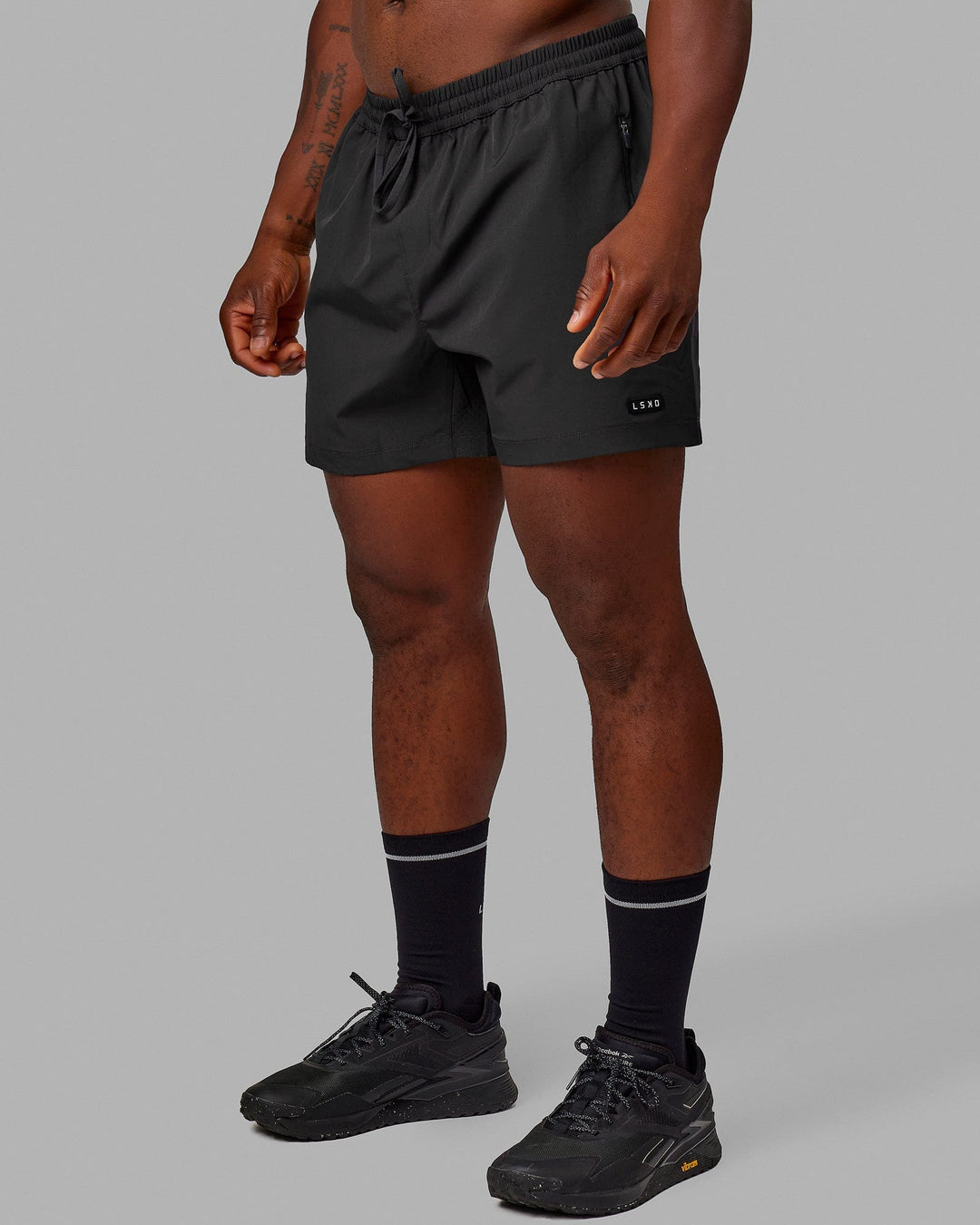 Man wearing Rep 5'' Performance Short - Phantom