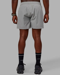 Man wearing Rep 5'' Performance Shorts - Ultimate Grey