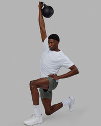 Man wearing Rep 7'' Performance Short - Graphite