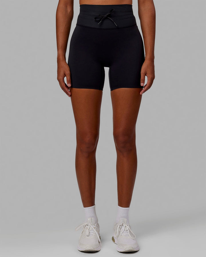 Woman wearing Resistance Mid-Length Shorts - Black
