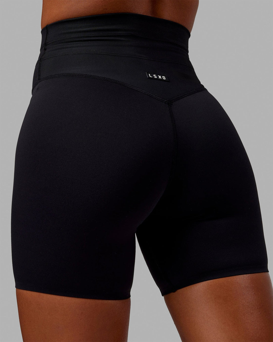 Woman wearing Resistance Mid-Length Shorts - Black