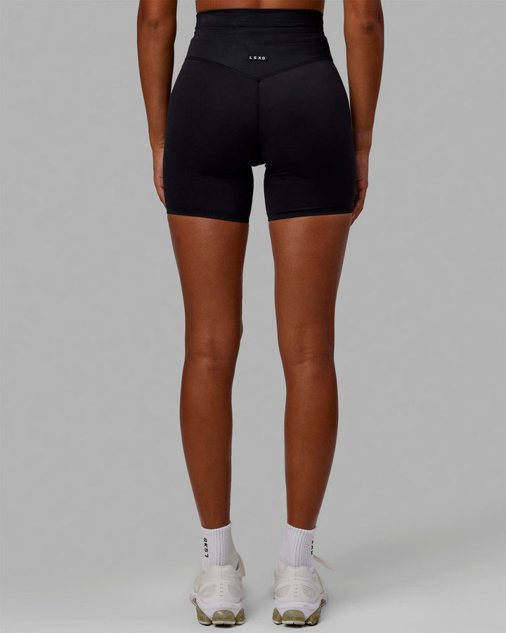 Woman wearing Resistance Mid-Length Shorts - Black
