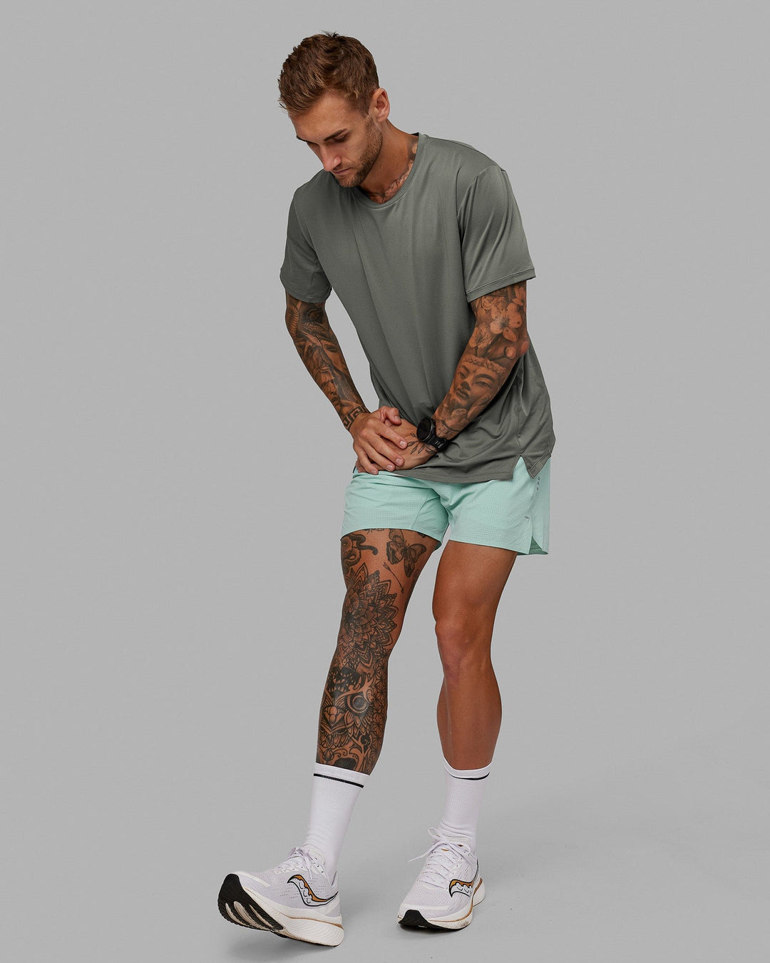 Man wearing UltraAir 5&quot; Lined Performance Short - Pastel Turquoise-Reflective