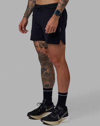 Man wearing UltraAir 5" Lined Performance Short - Black-Reflective