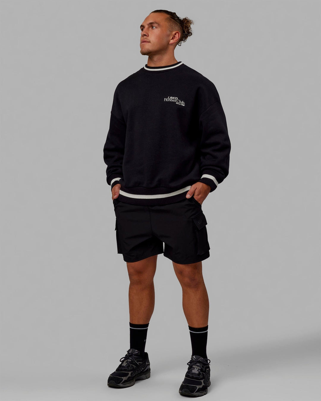 Man wearing Unisex Fitness Club Sweater Oversize - Black-Off White