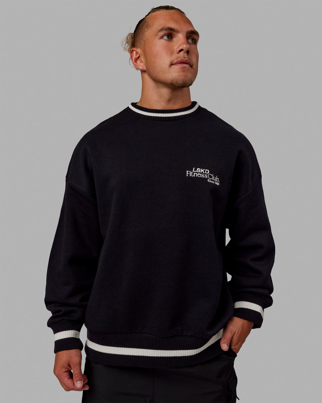 Man wearing Unisex Fitness Club Sweater Oversize - Black-Off White