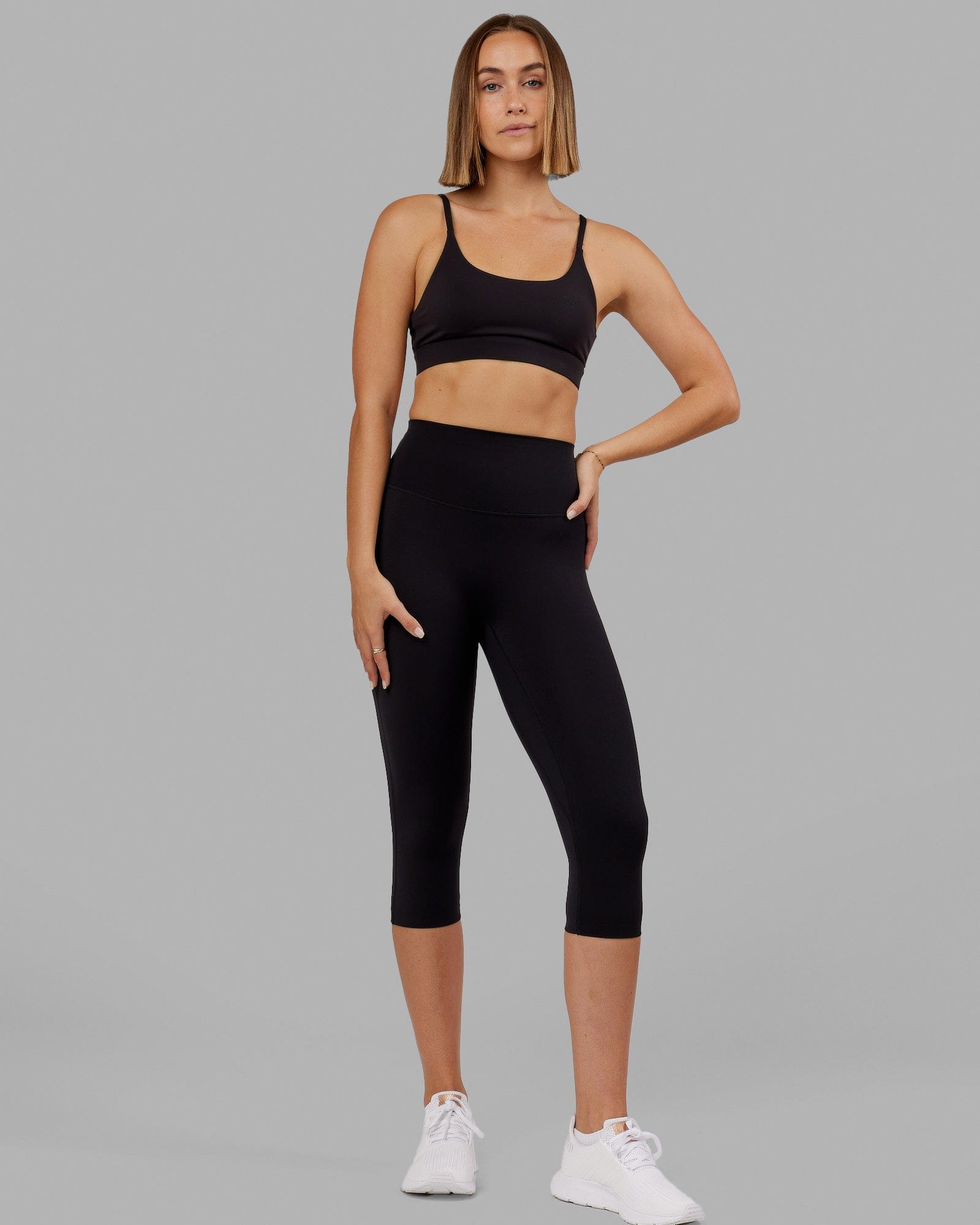 Woman wearing Elixir Ultra High-Rise 3/4 Legging - Black | Model:Chelsea | Size:S