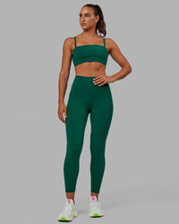 Woman wearing Fusion Ultra High-Rise 7/8 Legging Pockets - Malachite | Model:Sophie | Size:S