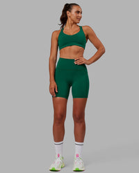 Woman wearing Fusion Ultra High-Rise 6" Short Pockets - Malachite | Model:Sophie | Size:S