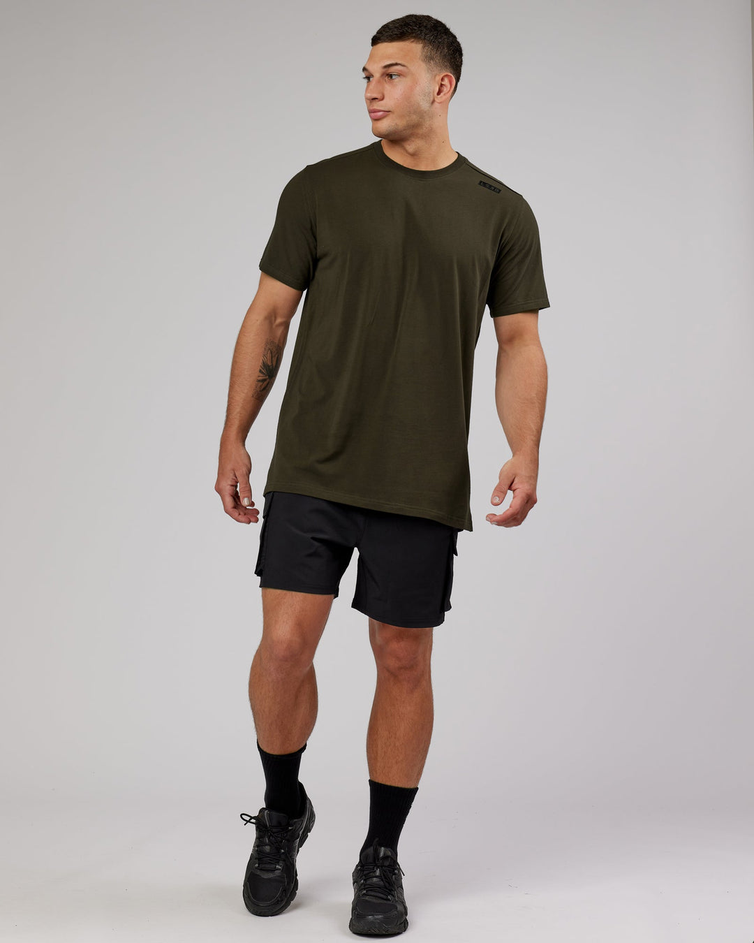 Man wearing Energy Stretch Performance Cargo Short - Black