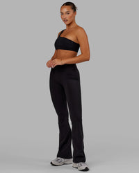 Woman wearing Fusion Ultra High-Rise Flared Legging - Black | Model:Milly | Size:S